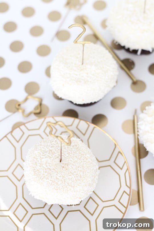 DIY Countdown Cupcakes - A full display of cupcakes with lit sparklers, creating a festive and celebratory atmosphere.