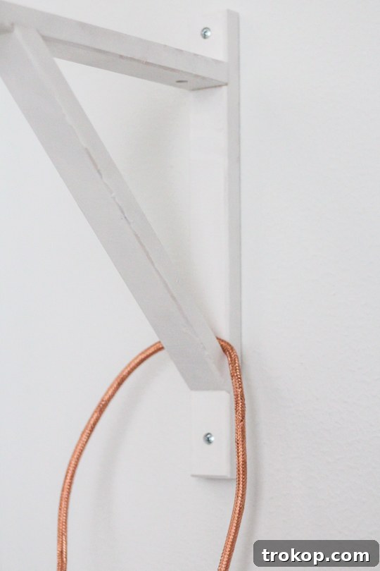 DIY pendant sconce with wall mount - Step-by-step cord wrapping.