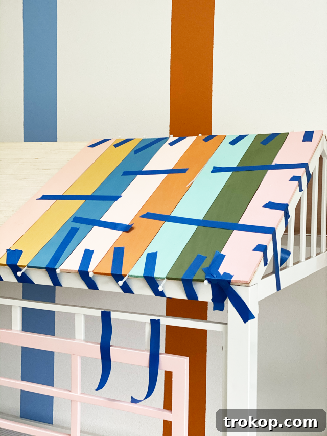 Vibrant DIY Toddler Playhouse Bed 11 tape the roof panels together