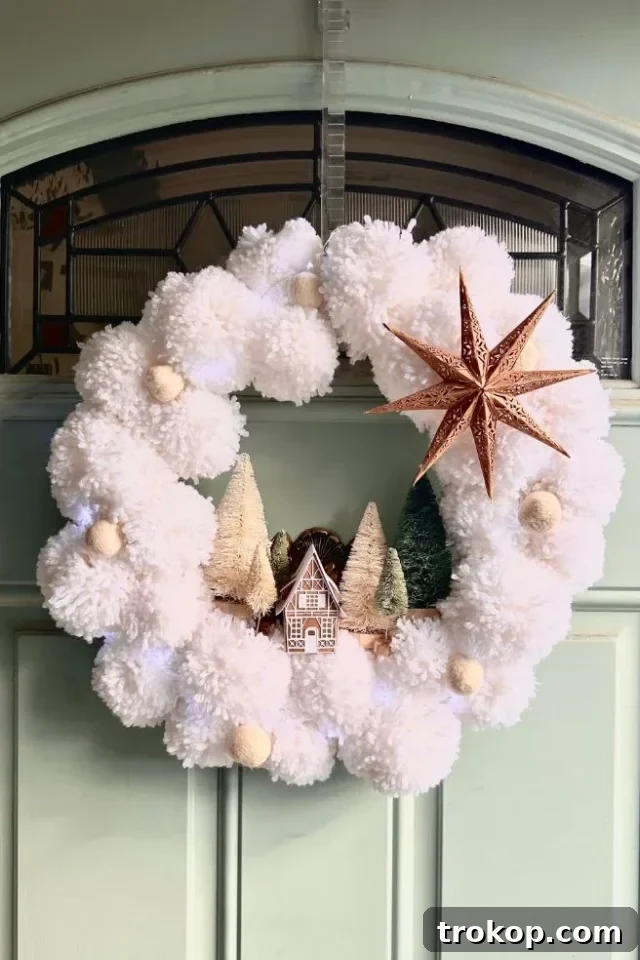 27 Handmade Christmas Wreaths for a Festive Home 17 Unique DIY Christmas Village Wreath featuring miniature houses