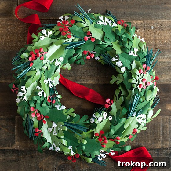 27 Handmade Christmas Wreaths for a Festive Home 18 Handmade Paper Christmas Wreath with holly leaves and berries
