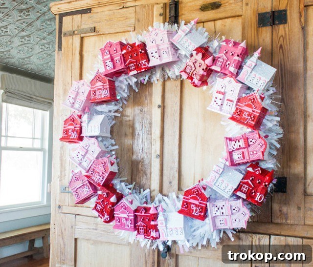 27 Handmade Christmas Wreaths for a Festive Home 22 Interactive DIY Christmas Village Advent Calendar Wreath with mini houses
