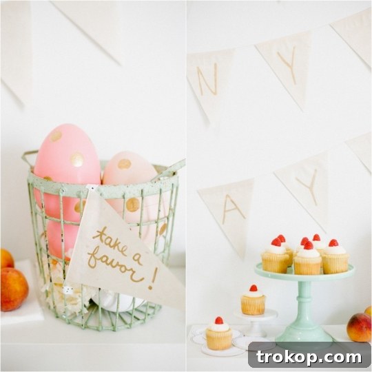 Bright Easter Sunday Dessert Table Inspiration 4 Close-up of a raspberry layer cake and vanilla bean cupcakes on an Easter dessert table