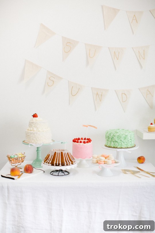 Beautifully decorated Easter dessert table featuring a raspberry cake