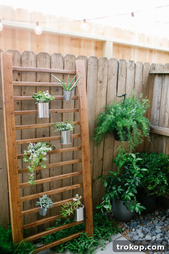 DIY Vertical Garden: An Easy Succulent Wall Planter Wooden vertical garden in a backyard setting