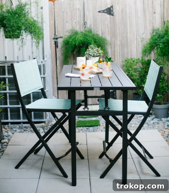 Patio set with DIY faux grass stepping stones and outdoor decor